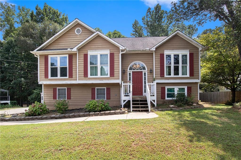 You'll adore this single-family home, featuring 4 bedrooms and 2 bathrooms, nestled on a private 0.48-acre lot in East Paulding. The generous living area includes a large family room, a kitchen, a dining area, and a separate dining space. Enjoy cozy winter nights by the log starter fireplace in the living room. The backyard boasts a storage building or workshop and an additional shed. Plus, there’s no HOA!