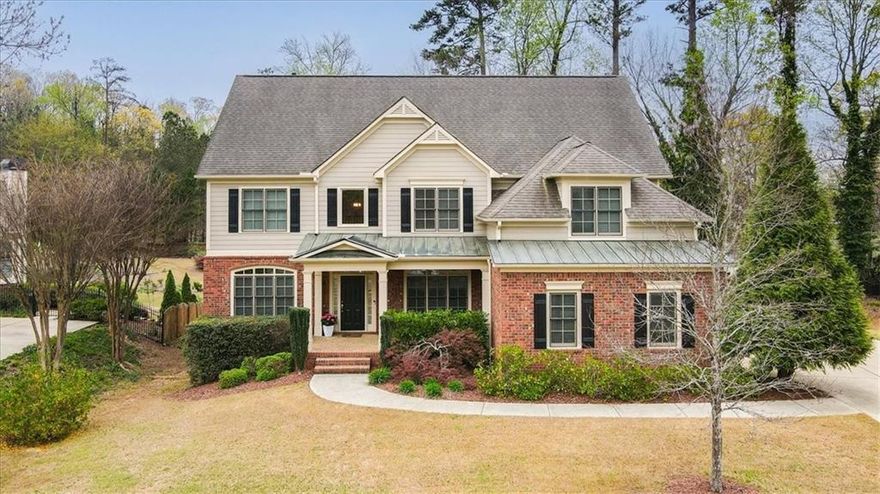 MOTIVATED SELLERS ...PRICE REDUCED!! Just minutes from the esteemed Mount Paran Christian School and conveniently close to I-75, I-575, Historic Marietta Square, and vibrant Kennesaw, this meticulously maintained residence perfectly blends luxury with convenience. Quietly nestled in Towneside Square—a quaint, private enclave of just 19 executive homes—this gem awaits you. A long driveway leads to a side-entry three-car garage, enhancing curb appeal and convenience.

Step into luxury as you enter the bright, airy, two-story foyer, showcasing elegant, hand-scraped Virginia hardwood flooring that extends throughout the main level. The open floor plan effortlessly accommodates modern lifestyles, boasting a dedicated office, formal dining room comfortably seating 12+ guests, and a conveniently located bedroom with a full bath on the main floor.

The stunning kitchen is both sophisticated and functional, featuring ebony cabinetry, granite countertops, a stylish tile backsplash, stainless steel appliances, and a striking ivory island. Adjacent is a charming breakfast room and a classic fireside keeping room—perfect for cozy mornings or relaxed evenings.

The sun-filled family room is highlighted by a beautiful coffered ceiling, custom built-in bookshelves, and a cozy fireplace, offering warmth and elegance. Step outside onto the deck, where you'll overlook a private, wooded lot; your peaceful retreat.

Upstairs, you'll discover five spacious bedrooms and a versatile flex room ideal as a playroom, homeschool room, media room, or library. The expansive primary bedroom suite is a true sanctuary, featuring an oversized layout, tranquil sitting area, generous his-and-her closets, and a luxurious bathroom complete with a peaceful soaking tub, separate shower, dual vanities, and stylish tile flooring. Secondary bedrooms are generously sized with ample closet space.

The expansive, unfinished basement offers over 2,000 square feet of endless possibilities for customization, additional living areas, or ample storage. Situated on a quiet cul-de-sac, this property ensures both peace and privacy, making it a truly exceptional find.