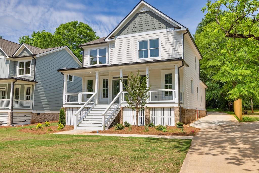 The Evergreen Plan by Expo Homes where luxury meets small-town charm in Downtown Monroe! This beautifully crafted custom 4-bedroom, 2.5-bath home is perfectly situated just steps from restaurants, shopping, and entertainment. Enjoy a bright, open-concept layout with a gourmet kitchen featuring custom cabinetry and premium finishes overlooking a spacious family room with a cozy fireplace. The main-level owner's suite offers a large walk-in closet and spa-inspired bath with a custom tile shower. Upstairs features three oversized bedrooms with walk-in closets, a stylish shared bath, and a versatile loft ideal for an office, media space, or playroom. The laundry room is conveniently located on the main level. Outdoor living shines with a covered front porch, private covered back patio, and a rare, oversized backyard. This is a custom home with the option to add a garage or additional living space. Designer finishes, upgraded trim, and thoughtful design throughout. Only two homes available! Quick Move-In ready NOW! Don't miss your opportunity to live in Downtown Monroe!