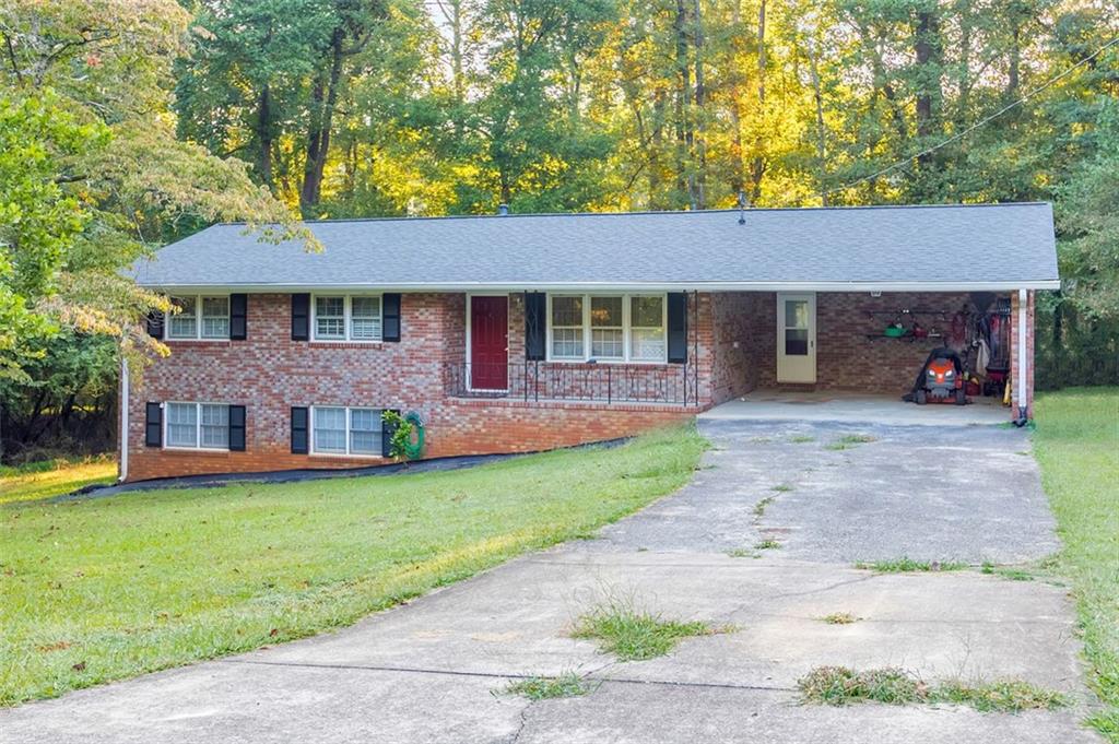 Welcome to this charming 5 bed / 3 bath four-sided brick ranch with a full finished daylight basement, just half a mile from downtown Kennesaw! The main level offers hardwood floors and an open floor plan designed for both entertaining and everyday living. The kitchen features white cabinets, granite countertops, and flows seamlessly into the living spaces. The primary suite with an en suite bath is located on the main level, while two additional bedrooms share a hall bath. The finished basement offers incredible versatility, perfect as an in-law suite or rental opportunity, complete with a kitchen, full bath, and two bedrooms. Enjoy relaxing or entertaining on the back deck overlooking the private backyard. Additional updates include a roof that’s approximately 4 years old, a water heater just 2 years old, and hardwood tile flooring in the basement. The home has no carpet other than the stairs leading to the basement, making upkeep easy. Tucked away in an established neighborhood with no HOA and just minutes from I-75, I-575, and Kennesaw State University. This home also sits just a short stroll to historic downtown Kennesaw which offers a vibrant mix of local restaurants, shops, community events, concerts, and seasonal festivals, giving you plenty of opportunities to enjoy the area’s small-town charm with big-town conveniences.