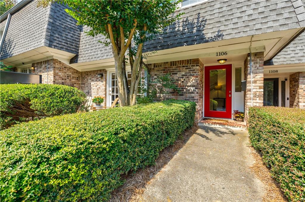 This townhome is a hidden gem. Located in Hampton Way, a charming community of just 32 homes, this condominium offers both privacy and conveniently located in Woodland Hills—close to Midtown and Buckhead. Spacious yet cozy, the home has been lovingly updated by the current owners and is truly move-in ready. It features gracious open living areas, an updated kitchen and baths, tile flooring on the main level, newer carpet upstairs, a newer HVAC system with smart thermostat, a brand-new water heater, smooth ceilings on the main floor, fresh paint throughout, and custom recessed and decorative lighting. A full list of upgrades is available. Priced below recent comparable sales, this home is a bargain! Highlights include a lovely front patio, a bright foyer with a new glass front door and sidelights, an oversized living room with recessed lighting and French doors, and a dining area that flows seamlessly into the kitchen with breakfast bar. The powder room is perfectly placed for guests, while the updated kitchen features painted cabinetry, granite countertops, stainless Whirlpool appliances—including an electric range with a glass vent hood—tiled flooring, and a coordinating backsplash. Adjacent to the kitchen is a bonus living space with two dramatic skylights, ideal for use as a den and dining area. A spacious utility and laundry room adds functionality, while the private two-car garage offers ample storage and workshop space. Upstairs, the large primary suite features a ceiling fan, private tiled bath with dual vanities, a tub/shower combo, and a walk-in closet. Two additional guest rooms share an updated hall bath with a granite-topped vanity and tiled tub/shower combo. Additional features include a two-car garage, abundant storage, a community pool, clubhouse, dog walk, and close proximity to the Morningside Nature Preserve.