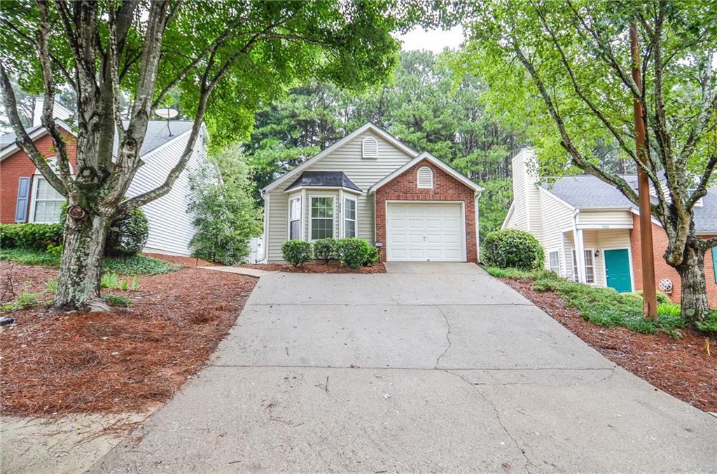 Welcome to 204 Chelsea Court, an adorable 2-bedroom, 2-bath home with a one-car garage, ideally situated just minutes from Kennesaw State University. A private side-entry front door invites you into a welcoming foyer that opens to a spacious, open-concept layout. The dining area flows seamlessly into the L-shaped living room, highlighted by vaulted ceilings, while the large U-shaped kitchen offers plenty of counter space for cooking and entertaining. The primary suite is a true retreat, complete with a charming bay window, a generous bathroom, and a large closet. The secondary bedroom and hall bath provide a perfect setup for a roommate or comfortable guest accommodations. The private garage comes pre-wired for an EV car charging station, adding modern convenience. Outside, the fenced backyard features a cozy patio—ideal for sipping your morning coffee or relaxing in the evenings. Located close to shopping, dining, and with quick access to major highways, this home combines charm, convenience, and opportunity. Plus, with an HOA that has no rental restrictions, it’s a fantastic investment opportunity for long-term rental, short-term rental, or personal use.