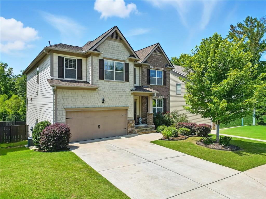 Situated on a spacious lot in the new section of the Centennial Lakes subdivision, this beautifully maintained 5-bedroom, 3.5-bath home in Acworth, GA, offers the perfect blend of style, space, and comfort. Bright and airy, the open-concept floor plan is ideal for everyday living and entertaining.
The chef’s kitchen features granite countertops, stainless steel appliances, and an eat-in area for casual meals. A formal dining room provides an elegant space for family dinners or special occasions. Living areas flow seamlessly to an expansive deck and large concrete patio below, overlooking a fully fenced backyard—perfect for gatherings, play, and pets.
Retreat to the luxurious master suite with coffered ceilings and a spa-like bath boasting a separate soaking tub, tiled shower, and double vanity. Four additional bedrooms offer plenty of space for family, guests, or a home office.
A full basement adds flexibility for extra living or recreation, and thoughtful finishes throughout highlight the home’s quality and care. The home also features extremely high-end 50-year shingles, providing both durability and peace of mind. Every detail reflects meticulous maintenance, ensuring a move-in-ready experience.
Located in the new section of Centennial Lakes, you’ll enjoy a peaceful neighborhood while staying close to shopping, dining, and top-rated schools. This home perfectly combines elegance, functionality, and convenience—ready to welcome its next lucky owners.