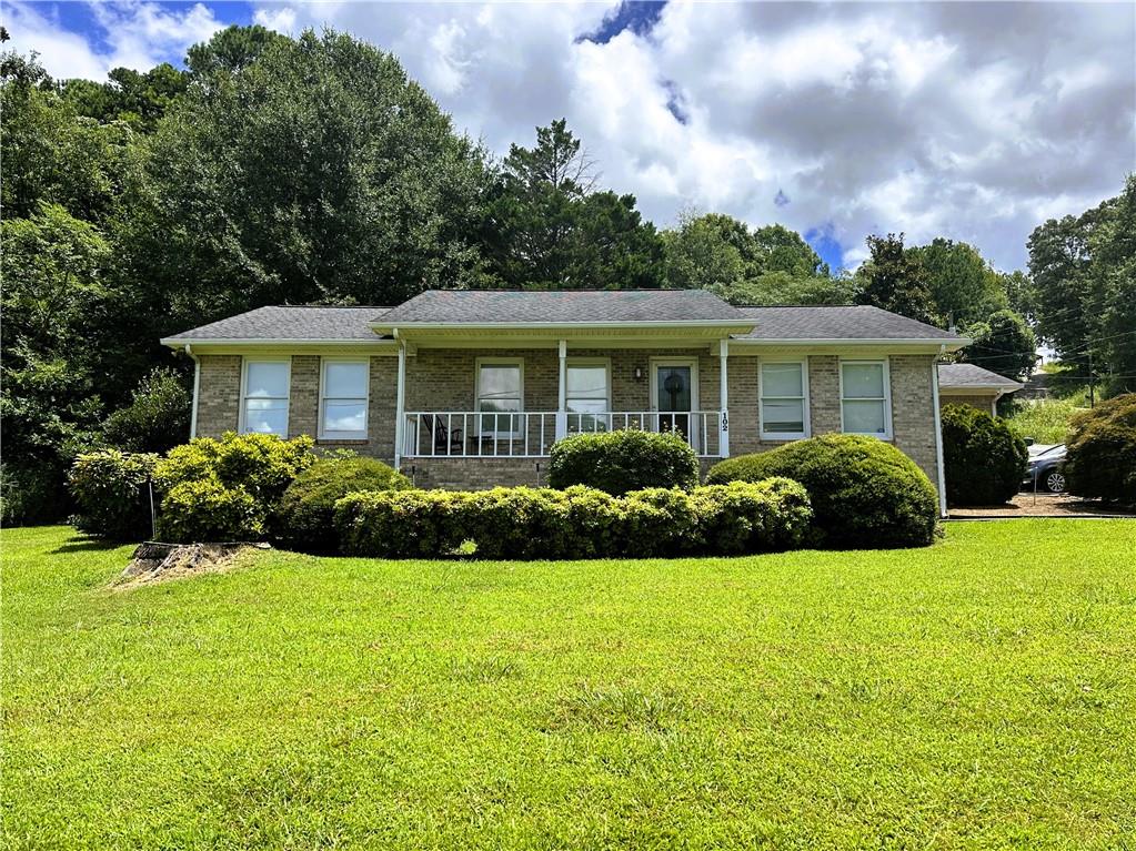 This very conveniently located all brick ranch style home in a great in-town location features a large and open family room with hardwood flooring, a very accommodating eat-in kitchen with excellent cabinet and counter space, a spacious primary suite that features a large walk-in closet as well as a 4 piece attached bath with a separate bathtub and shower, an additional large bedroom and guest bath are also included, as well as a nice laundry room. Single car attached garage. Home has fresh interior paint less than a year old. Sit on the spacious rear deck or the large covered front porch and enjoy the private low maintenance corner lot. HVAC system is only approx 3 years old as well. All kitchen appliances to stay, as well as washer and dryer. Located conveniently to all Calhoun City Schools, with the Calhoun Early Learning Academy just down the road, as well as very convenient to the local downtown area, and less than 1 mile to Advent Hospital and I-75. If looking for a low maintenance home in a fantastic in-town location, then this could be the one for you!