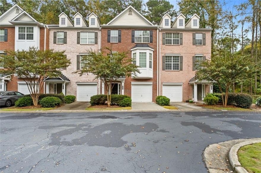 Truly a neighborhood gem! This stunning, newly renovated tri-level townhome is tucked away at the end of the desirable,
privately gated Cambridge community. The home features 3 spacious bedrooms and 3.5 baths. The main level offers an open
floor plan with a large kitchen island featuring double-sided cabinetry, granite countertops, a tile backsplash, and stainless
steel appliances. The bright and airy family room includes a fireplace and a comfortable dining area - perfect for
entertaining.
Upstairs, you'll find generously sized bedrooms with tray ceilings and custom closet organizers. The primary suite includes a
spa-like bathroom with dual vanities, a freestanding tub, and a walk-in shower. Additional highlights include a new roof, new
flooring, and fresh interior paint. Enjoy a wooded backyard offering both privacy and natural beauty.   Located just minutes from major highways, Perimeter Mall, Avalon, and Downtown Roswell, this home offers the best of
convenience and lifestyle. Take in the stunning views of the Chattahoochee River, explore nearby hiking trails, water sports, and playgrounds at Morgan Falls Overlook Park or enjoy a round of golf at Steel Canyon Golf Club, both within walking distance.