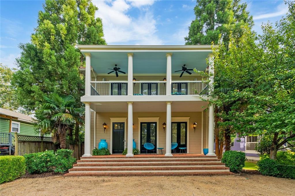 Custom-built in 2008 and thoughtfully occupied by its original owner, this residence was crafted with timeless detail and a focus on entertaining. From the moment you arrive, the home’s wide front porch welcomes you with classic Southern charm. French double doors connect the front and rear porches, creating an easy flow for gatherings and opening the home to abundant natural light and breezes.
Inside, the main level is defined by tall ceilings, expansive rooms, and exquisite architectural touches. The formal dining room showcases elegant box-beam ceilings, setting the stage for memorable dinners and celebrations. Just beyond, a warm paneled den with handsome pocket doors offers views of the rear yard—an inviting retreat for quiet evenings or lively conversation. Each space was designed to balance gracious proportions with livable comfort.
Upstairs, the second floor primary suite is a true retreat. Featuring two walk-in closets, a luxurious soaking tub, and three sets of double doors that open to an expansive second-story front porch, the suite provides both comfort and connection to the outdoors. The covered porch becomes an extension of the living space, perfect for morning coffee, evening relaxation, or hosting guests with views of the neighborhood.
Additional conveniences include a rear-entry garage with alley access and a versatile walk-up storage area above, ideal for future expansion, a workshop, or simply abundant storage. Every detail of this home reflects thoughtful design and enduring craftsmanship.
Positioned just two blocks from East Lake Village and a short distance to both Kirkwood and Oakhurst Villages, the home offers quick access to dining, shopping, parks, and community events. Whether entertaining large groups or enjoying quiet weekends at home, this residence blends refined architecture, livable comfort, and an unbeatable location in one of Atlanta’s most beloved neighborhoods.