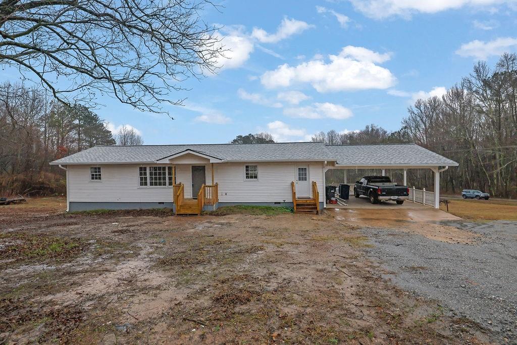 Due to no fault of the seller, this charming and fully renovated 3-bedroom, 1-bathroom ranch home on a spacious 1-acre corner lot in South Forsyth is back on market. This single-story home features fresh interior and exterior paint, new flooring, new septic system, and a brand-new roof. The eat-in kitchen is a highlight, offering solid surface countertops, new appliances, and a seamless view into the family room, perfect for entertaining. Located near excellent shopping and highly rated schools, this property is ideal for convenience and lifestyle. Don't miss this opportunity-schedule your showing today!