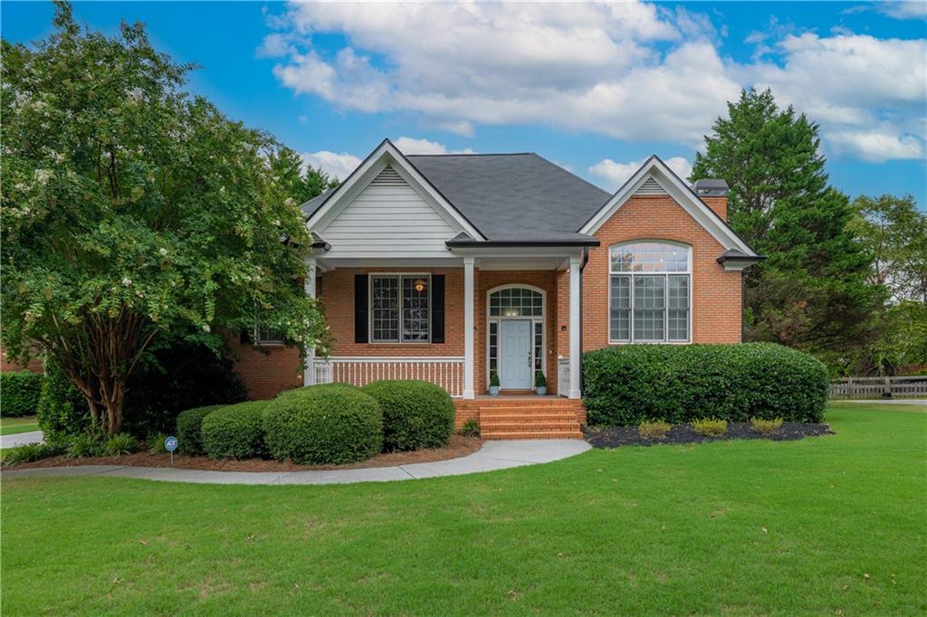 Welcome to 11 Hampton Lane, a stunning Cartersville gem, nestled in the coveted Waterford community! This exquisite 3-sided brick home captivates with its sophisticated charm and thoughtful design. The heart of the home is a bright living room, anchored by a cozy gas fireplace, gleaming hardwood floors and exquisite picture windows. Entertain with ease in the open concept dining area or gather in the gourmet kitchen, featuring crisp white cabinetry, a pantry, stainless steel appliances, a breakfast bar, and a sunny dining nook with direct access to a brand-new, expansive upper deck—ideal for morning coffee or sunset soirées.
The primary suite is a serene retreat, boasting elegant tray ceilings and a luxurious en-suite bath with a double vanity, separate shower, tiled floors, and a relaxing jet tub. Downstairs, a versatile lower level offers a spacious family room, a fourth bedroom, and a full bath, with doors opening to a huge, flat back yard that’s just screaming for a pool! The fully fenced backyard, newly installed for complete privacy, creates a peaceful oasis for outdoor enjoyment. Additional highlights include new garage doors for the double car garage, complete with a separate storage area or workshop!
The Waterford presents a collection of exceptional amenities, including a clubhouse, Olympic-size pool, tennis and pickleball courts, clubhouse, playground, and cabana. Directly across the street, Dellinger Park offers wooded running trails, a city pool, athletic courts, picnic pavilions, and a tranquil pond. Zoned for Cartersville City Schools and just 7 minutes from downtown, residents enjoy convenient access to shopping, dining, and the vibrant culture of Cartersville. Grab this sweetheart of a deal while you can!
