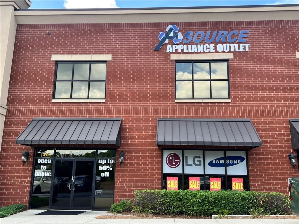 Incredible Flex Condo in Prime Duluth Location – Office, Retail, Warehouse Ready - Don’t miss this rare opportunity to own a high-quality, 4,014 SF flex space in the sought-after business corridor of Duluth. Located just off Pleasant Hill Road near Buford Highway and I-85, Unit 450 at 2730 N Berkeley Lake Rd NW offers unbeatable access, visibility, and versatility for your business or portfolio. The main level features approximately 3,034 SF of open-use space with tall ceilings, roll-up drive-in access, and finished areas suitable for retail, showroom, light industrial, or warehousing. The second-floor mezzanine adds an additional 974 SF of built-out office space with large windows, private offices, and open areas filled with natural light—ideal for administrative operations, meetings, or creative teams. Dock is level and a 53" foot truck can enter the unit if needed. 220 Volt EV Charger included. Constructed in 2006, this all-brick, flex condo is part of a well-managed professional complex. The HOA maintains the exterior, roof, landscaping, water/sewer, and trash services, making ownership simple and predictable. Building signage is available and shared parking is plentiful. The unit allows for a wide range of professional and commercial uses. 24-hour building access and a location on a bus line add even more functionality. This unit will be sold vacant—ideal for owner-users looking to customize their space or investors seeking strong upside in a rapidly appreciating area. Surrounded by thriving retail, restaurants, banks, and office parks, this location continues to attract a mix of national and local businesses. Unit should qualify for traditional commerical or SBA financing.