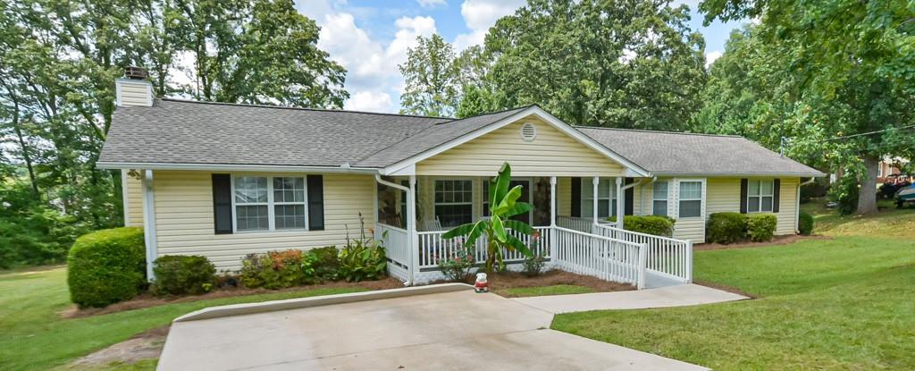 Beautiful well maintained ranch home with large lot tucked away in the heart of the cross roads area! Quiet neighborhood close to everything! Open concept with each room flowing to the next. Large master bedroom and bath. Large kitchen! Great house for entertaining your guests. Sit in your living room with a cozy fire to keep you warm in the winter months. The screened back porch is perfect for relaxing with a good book and glass of wine. Awesome schools in the North Paulding district. Don't miss your opportunity to own you own little peace of paradise!