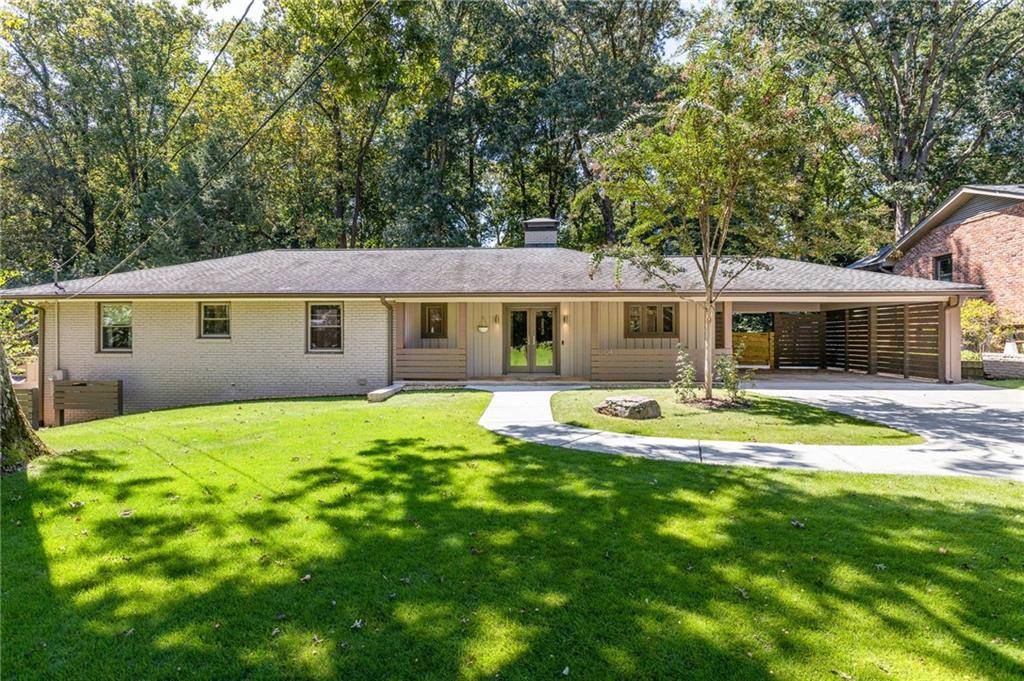 1104 Mason Woods Modern Mid-Century Living with Seamless Expansion This beautifully updated and expanded four-bedroom, three-and a half bath mid-century modern sits on a large, level, landscaped lot filled with sun, grass, and tranquility in desirable Mason Woods. The home offers an open floor plan, abundant natural light, hardwood floors, and effortless flow between upstairs and downstairs spaces. The main level features a gorgeous primary suite with oversized spa bathroom and walk-in closet, plus two secondary bedrooms and an en suite, and stylish hall bath. Living and dining areas connect to a modern kitchen and a screened porch overlooking the backyard, creating a perfect setting for everyday living and entertaining. The newly finished basement lives like a true extension of the home, with hardwood floors, a second den, full kitchen with walk-out patio, and a spa-like bath. A service window to the yard makes entertaining a breeze, while flexible design allows the level to function as an in-law suite, au pair suite, or guest retreat. The deep backyard expands the living space outdoors, while the thoughtful layout ensures every inch of the property is usable, connected, and private. Unbeatable Location: Minutes to Emory, CDC, CHOA, and Toco Hills shopping and dining, with quick access to downtown Decatur. Nature lovers will appreciate nearby Lullwater Preserve, Candler Lake, and WD Thompson Park. A rare opportunity to own a home that combines modern design, flexible living, and a premier location, all in one.