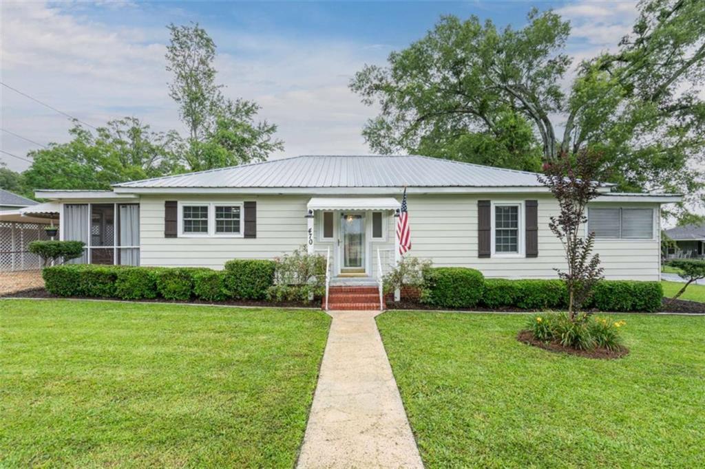 Welcome home to this beautifully updated 2-bedroom, 2-bath charmer! Step inside to an oversized, stylish living room that flows seamlessly into the dining area and kitchen. Fresh interior paint and major system updates in 2019-including HVAC and electrical-mean peace of mind for years to come. The thoughtful layout creates a warm, inviting feel throughout. Outside, enjoy a fenced-in backyard that's perfect for kids or pets, plus a handy storage building. Need an extra bedroom? The dining room is conveniently located off the guest bath and could easily be converted into a third bedroom. Don't miss this versatile and move-in-ready gem!