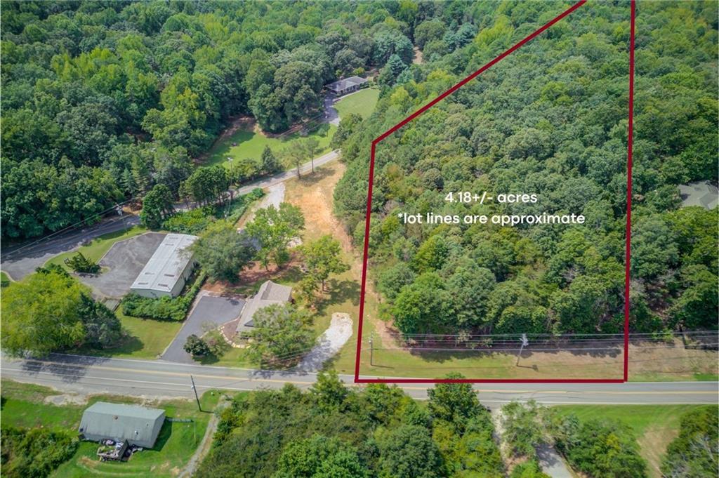 Parcel #: 273 005: 4.18+- Acres zoned Neighborhood Shopping with dual road frontage on Shady Grove Rd and Heard Rd. Active Building & Conceptual plans are available. Soil Test & Survey available. Located approx. 3.8 miles from GA 400 via exit 18. Close to Grocery and Dining options on Browns Bridge Road/State Hwy 369. Less than 1 mild from Lake Lanier & major public boat ramp. Septic only, no sewer available. Mostly flat topography. Mostly hardwoods. This property can also be sold with 6700 Shady Grove Rd, Parcel #: 273 004.
