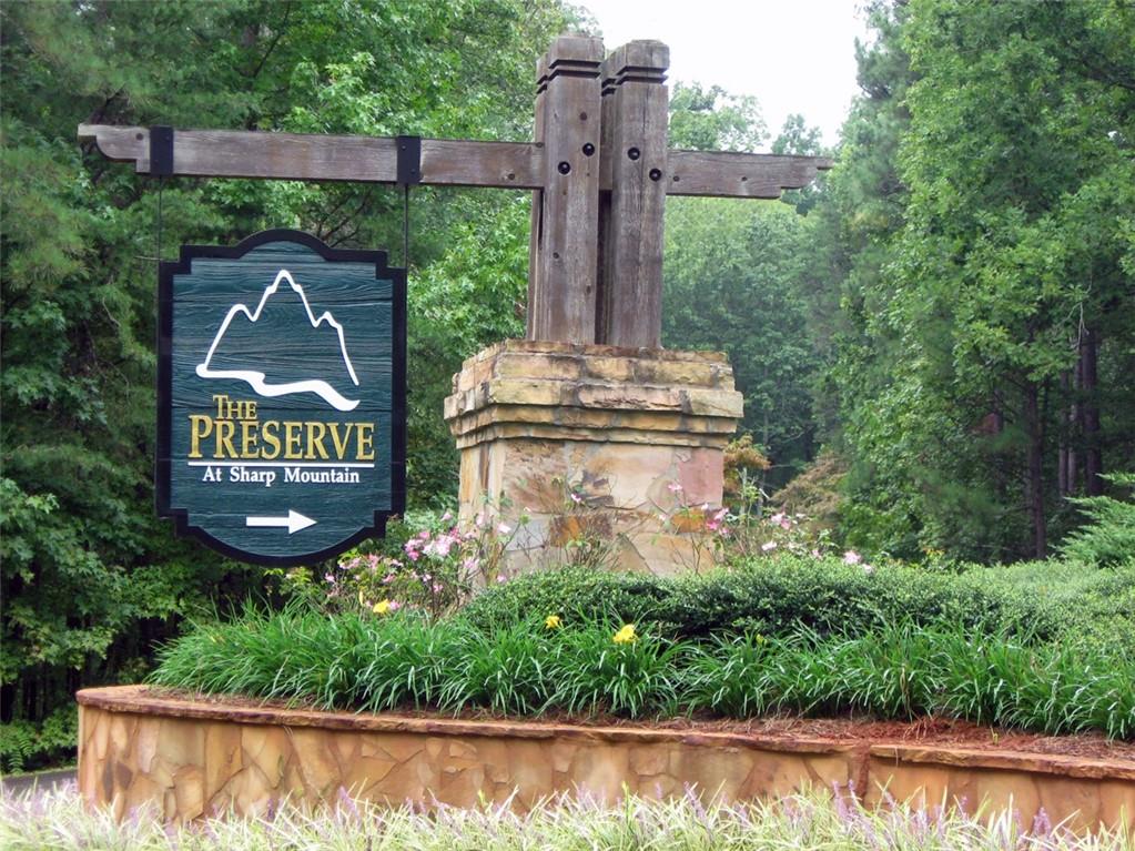 WELCOME TO YOUR NEW MOUNTAIN HOME !! This beautiful, heavily wooded 3.06 acre lot is located in The Preserve at Sharp Mountain which is one of the premiere gated communities in Pickens County. The Preserve at Sharp Mt is located just 10 minutes from a hospital, shopping & downtown Jasper. Beautiful nature preserve amenities such as parks, hiking trails, gorgeous pavilion, gazebos & much more are located within the community. Come see and get started building your new home. This subdivision is a very special place. Just ask the residents!!