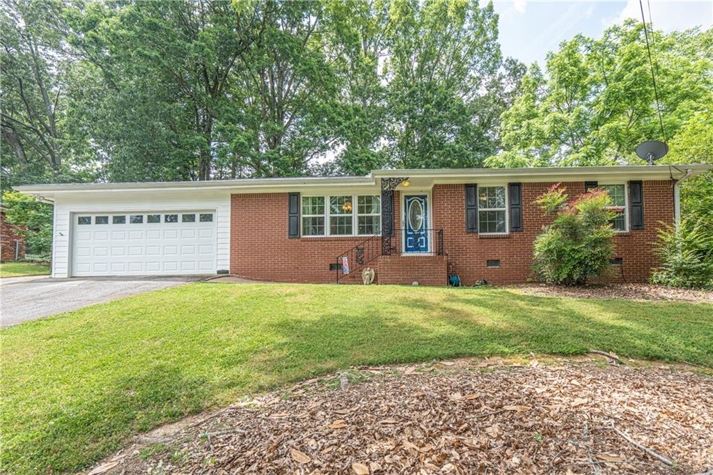 This adorable ranch is just waiting for a new family and will not last long. The original hardwood floors throughout except for the kitchen, dining room and bathrooms which are tile. Kitchen and bathrooms have been beautifully updated. The large patio in the back is an entertainer's dream overlooking the beautiful backyard loaded with too many perennials to list. There is a large outbuilding that the Seller has never had time to do anything with but does have a concrete slab floor. And did I mention NEW ROOF!