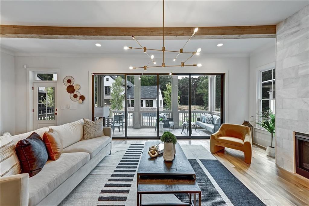 “A mini-Serenbe is taking shape around ITP Atlanta farm,” declares Urbanize Atlanta. And at the heart of it all is Pendergrast Farm—Atlanta’s most innovative and environmentally conscious community.
Welcome to a one-of-a-kind architectural gem that blends cutting-edge design with sustainable living. Rooted in the legacy of the Pendergrast family and surrounded by preserved green space, this conservation community is more than a place to live—it’s a way of life-Where Nature Meets Innovation.
Thoughtfully arranged around a thriving 1-acre organic farm, just 20 high-performance homes create an intimate, eco-forward neighborhood unlike any other in Atlanta. Watch the farm-to-table experience unfold before your eyes as seasonal fruits and vegetables grow steps from your door—then get delivered to your home each month as part of the community CSA.
Live Among the Trees - Set on 5.5 acres of protected woodland with winding trails and a bubbling stream, the natural beauty here is immersive. Whether you're walking your dog under a canopy of trees, cooling off in the saltwater lap pool, or enjoying the peace of your screened-in porch, Pendergrast Farm offers serenity you wouldn't expect this close to the city.
Designed for Community Connection-At the heart of the neighborhood, the Common House brings residents together with a commercial-grade kitchen, flexible gathering spaces, and a calendar full of shared events—think wine tastings, cooking classes, potluck dinners, book clubs, and yoga sessions. Downstairs, the Maker’s Space is a creative haven for woodworking, painting, and hands-on projects.
Modern Elegance Meets Farmhouse Charm-This home makes a lasting first impression with double Charleston-style front porches and a disappearing glass wall that frames uninterrupted views of the organic farm and Common Green. Inside, 10' ceilings, site-finished white oak floors, and curated details evoke understated luxury throughout.
The heart of the home—a chef’s kitchen—features custom cabinetry with abundant storage, a 36" Thermador gas range with its patented star burners and a concealed, super powerful vent hood. A built-in wet bar makes entertaining a breeze, while the spacious walk-in pantry and nearby home office nook elevate everyday living.
The vaulted-ceiling primary suite is your private sanctuary, with a screened balcony perfect for morning coffee or evening quiet. The spa-like bath offers a double-headed shower and deep soaking tub, inviting you to indulge in relaxation.
Flexible Living for Today’s Needs
The terrace level offers a private-entry suite with its own courtyard—ideal for a nanny, in-laws, guests, or even a future rental opportunity.
High-Performance, Future-Ready
This home is built for both comfort and conscience. It’s solar-ready, pre-wired for a 60AMP EV charging station, and fully insulated with spray foam in all walls and rooflines—ensuring energy efficiency and peace of mind.
Intown Convenience with a Countryside Soul
Tucked just off Briarcliff Road near Clairmont, Pendergrast Farm offers the rare combination of urban access and natural seclusion. It’s a front-row seat to a bold new way of living—an eco-conscious retreat just minutes from Emory, Decatur, and all that Atlanta has to offer.
This is your chance to own a piece of the extraordinary—where sustainability, luxury, and community come together in perfect harmony. Experience life at Pendergrast Farm. There’s nothing else like it in Atlanta.