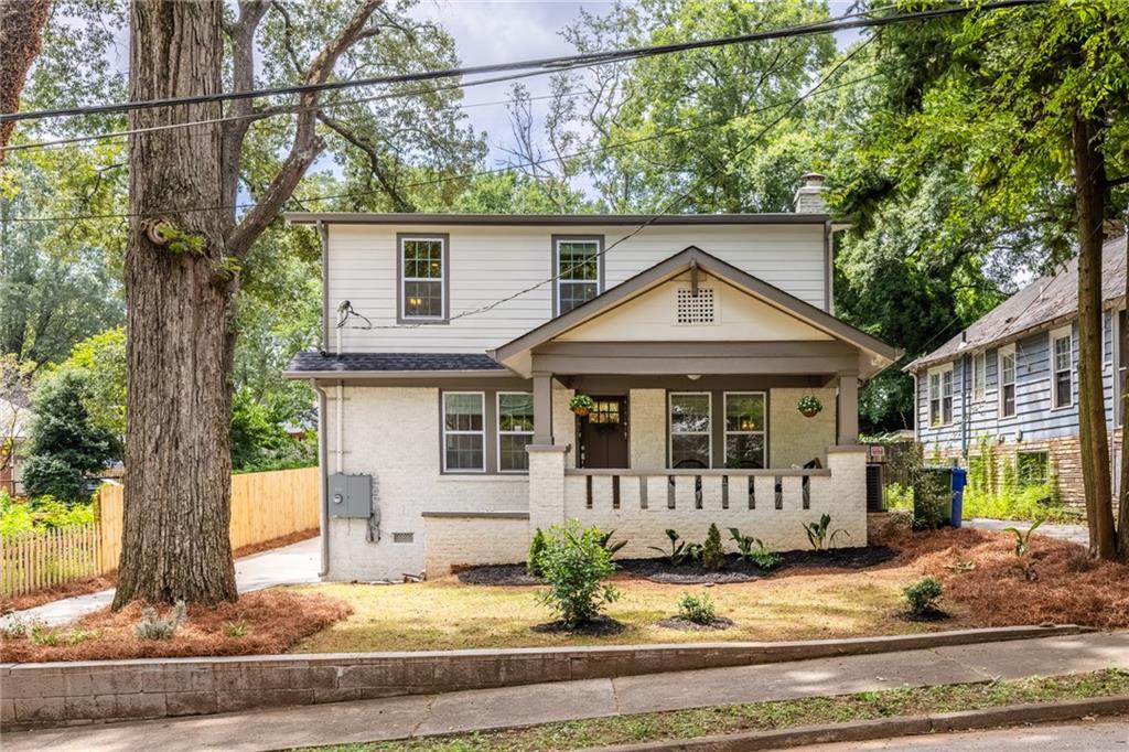 Expanded 1930s craftsman perched on a quiet lot in Sylvan Hills. This home lives large--5 bedrooms, 4.5 baths, and 2 primary suites with over 3300 square feet of living space. A quintessentially southern front porch overlooks Burns Drive, a quiet street in Sylvan Hills dotted with historic homes and shady trees. Inside, you'll find a blend of historic charm and modern updates--coffered ceilings, built-in bookshelves, and a fireside living room with gas fireplace. The kitchen is the heart of the home--a breakfast bar is the perfect spot for busy mornings, and ample tasking space and double ovens make hosting a breeze. French press? Espresso machine? Pourover? All three? This spacious kitchen has room to accommodate your caffeine intake ritual and then some--a dedicated butler's pantry has additional cabinet space, shelving, and beverage cooler. A separate walk-in pantry offers plenty of room for your Costco and Dekalb Farmer's Market hauls, which brings us to the dining room--it's time to brush up on your cooking, because you'll be hosting holidays from now on! The generous dining room comfortably fits everyone, so you'll be able to celebrate milestones and be within earshot of all of the gossip--no need for the awkward kids table in a separate room. Off the kitchen, a big laundry room and mudroom with built-in storage offers maximum convenience, along with a powder room for guests. On the main, the first primary suite has a walk-in closet and roomy tiled bath with double vanity and rainhead shower. Upstairs, a second primary suite also has a large walk-in closet and spacious tiled bath with double vanity and water closet. A third (yes, third!) ensuite is off the upstairs hall, and two additional bedrooms and hall bath round out the upstairs. This home is set on a large lot--over 150 feet deep. The peaceful backyard has a freshly stained deck perfect for entertaining. In the back of the yard, a poured concrete pad flanked by 3 walls is the ideal spot for a fire pit and Adirondack chairs, future greenhouse, or studio. Savvy buyers, the current owner doesn't have the history of the back structure, but based on the terracotta mosaic patio and poured concrete, it was most likely an accessory dwelling of some kind. Sylvan Hills is a sweet community of historic homes on Atlanta's westside. Only a couple of blocks from verdant Perkerson Park, easy access to Tyler Perry studios and the continuously expanding Fort Mac, and a few short blocks to the exploding development along the westside Beltline. Ask about our rate buydown!