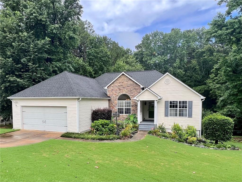Welcome home to this LOVELY true sprawling ranch home in a quiet community with close proximity to Tribble Mill Park and Harris Greenway Trail which connects Harbins and Tribble Mill parks. Fantastic school district, Archer High School! 3 bedrooms + 2 bathrooms + finished basement + study/home office. $3500/month this home comes with some furnishings, washer and dryer, and includes yard maintenance! NEW LVP flooring throughout the main living area and the owner's suite! The family room boasts a vaulted ceiling and stacked stone fireplace. The kitchen is complete with tiled backsplash, granite countertops and under cabinet lighting, opens to family room and dining. Primary bedroom features walk in closet, double vanity with granite countertop, stand up shower and soaking tub. Spacious secondary bedrooms share a gorgeous renovated bathroom as well. Don't forget about the finished basement!! The basement hosts an oversized family room with tons of natural light + an office + tons of additional space for storage. Enjoy relaxing, morning coffee and evening meals with tree top views on the upper deck located off the main living room overlooking the private back yard fenced to the tree line! The walk to the front door is lined with colorful blossoming flowers, vibrant greenery and plant life! Green thumb not required as all grounds maintenance including flower beds and shrubs will be professionally maintained!! Prime location close to Top Ranked Schools, Shopping, Grocery, Parks, and Restaurants!