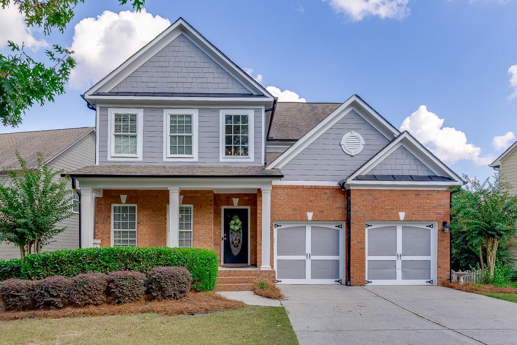 Beautiful home in Sterling on the Lake featuring a welcoming front porch, two car garage, and one of the best values currently available in the community.