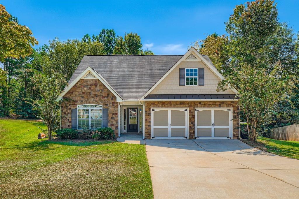 Ideally located just minutes from I-20 and Carrollton Villa Rica Highway, this beautifully maintained 3-bedroom, 2-bathroom home combines style, comfort, and convenience—with no HOA restrictions.
The spacious living room features soaring vaulted ceilings and a stone-faced fireplace, creating a cozy and welcoming atmosphere. A formal dining room with elegant double tray ceilings adds a refined space for entertaining, while the kitchen offers a charming breakfast nook, Grand Pearl countertops, and a dishwasher, perfect for everyday living.
The primary suite serves as a peaceful retreat, complete with double tray ceilings, a walk-in closet, dual vanities, a soaking tub, and a separate glass-enclosed shower.
Outdoor living is easy with a rear patio and fenced backyard, offering privacy and space for pets, play, or relaxation.
Additional features include a 1.5-year-old HVAC system—providing comfort and peace of mind.
This home blends thoughtful design with a prime location close to shopping, dining, schools, and commuter routes—making it a standout in the Villa Rica area.
Discounted rate options and no lender fee future refinancing may be available for qualified buyers of this home. Priced to sell and move-in ready.