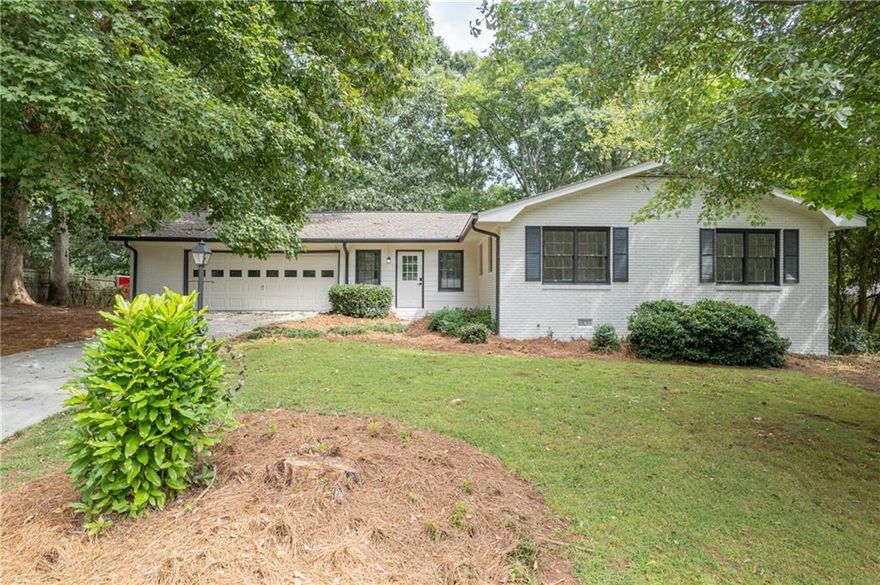 Welcome home to this beautifully updated ranch in the heart of Marietta. This "Like New" home boasts 3 bedrooms/ 3 full baths and a 4th airy bedroom loft that can double as an office or bonus room. All new appliances, new paint, new floors, brand new roof, updated bathrooms and kitchen- this home is turn-key and an entertainers dream! The secluded backyard is ready for you to add your touch to enjoy the outdoors peacefully. Located just minutes from Marietta Square and convenient access to I-75. Don't miss the chance to call this your home.