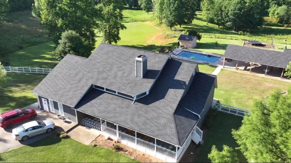 Farmhouse style Dream in Gainesville, GA! 14.42 acres at the end of a quiet country lane. 8 Bedrooms, 5 1/2 Bathrooms, Front Porch, Office,Hardwood Floors, Sunroom. Finished basement with bedrooms, bathroom, and kitchen adds flexible living space, whether you need a media room, game area, or home gym with tile floor and a back Screened porch. The spacious lot includes an in-ground swimming pool. A cabana with a larger outdoor kitchen, and counter area, refrigerator for refreshments, with semi-enclosed seating area that is steps from the pool but shaded from the sun, the multifunctional cabana turns the backyard into an entertainment gathering space for family, friends, or business meetings. Are you ready to play a game? Here it is your own private soccer/football field! It's about lifestyle enhancement and surrender by nature! Grow your own organic vegetables, on well water. The property has a small pond. Horses are permitted; in fact, there's a barn a few doors down with horses' house there. Don't miss the opportunity to own a beautiful farmhouse-style retreat set on a picturesque property perfect for equestrian enthusiasts. Schedule your showing today and start living your countryside equestrian dream! Convenient location near downtown Gainesville.
Lot 1312 x 535 x 1135 x 819 x 497 x 50.