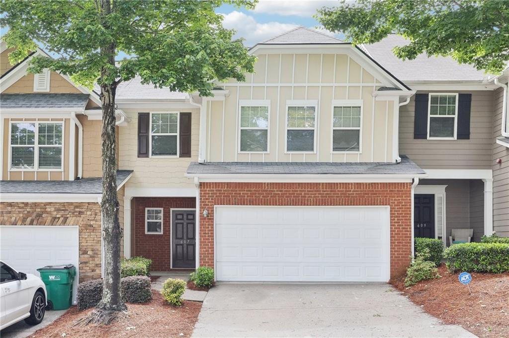 Perfect blend of style and convenience at this beautiful townhome just minutes from the heart of Downtown Woodstock. Nestled in a vibrant community, with easy access to your favorite Grocery stores (Publix, Kroger), Walmart, and over 30 local shops and dining destinations, and top-rated schools. This Light-filled Unit offers the ideal lifestyle for today's modern homeowner. This townhome boasts an open-concept floor plan, a two-story family room, an inviting kitchen featuring modern cabinetry, granite countertops, and plenty of space to entertain or to-simply unwind comfortably. The Kitchen appliances have all been updated by the seller!. Natural light pours through every room, accentuating the thoughtful design and airy ambiance. Refreshed with new paint, the downstairs flooring is covered with beautiful wood floors, and new carpet upstairs. You'll find three generously sized bedrooms upstairs, including an owner's suite with a spa-like bath and walk-in closet in the master bedroom for those who appreciate both luxury and functionality. Whether you're enjoying a peaceful evening at home or venturing out to the nearby Outlet Shoppes for designer finds, this location puts you in the center of it all, charming, connected, and incredibly convenient.
The community amenities include a Swimming Pool, clubhouse, Fishing Dock, Playground, and Miles of private Walking & Hiking Trails. Location, location, just off HWY 92 with Easy Access to 575 & 400, and minutes from Downtown Roswell, Downtown Woodstock, Marietta, Shopping, Restaurants, and Entertainment
Welcome to your next chapter in Woodstock.
*** Top School District. ***