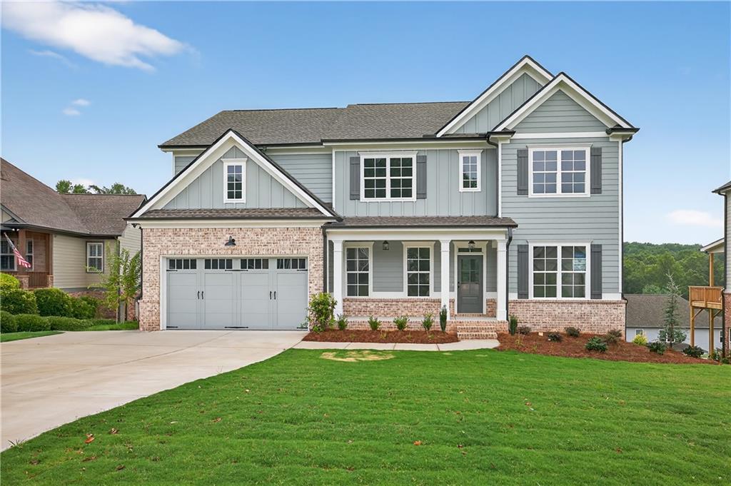 “LOT 109Q/JACKSON PLAN” Another impressive home in Traditions of Braselton by Hillgrove Homes! This floorplan boasts 5 bedrooms, 4 full baths and has all the designer touches. The spacious Gourmet Kitchen w/ oversized island overlooks the inviting Family Room. Coffered ceilings, shiplap, brick fireplace, cedar mantle and built-in cabinetry complete this space. The Kitchen features custom painted cabinetry w/ soft-close drawers, quartz or granite countertops, stainless steel appliances, tile backsplash, farm sink and spacious walk-in pantry. A Dining/Office/Flex Space and Study right off the Foyer boasts an extensive trim package. The oversized Primary Suite & Primary Bath add SO much space to this home and are complete with an oversized super shower and soaking tub, upgraded cabinetry and countertops, dual sinks and upgraded tile. Large secondary bedrooms (one full bed/bath on main level), closets & bathrooms are an extra perk. The covered back porch w/ fireplace is perfect for entertaining or back porch sitting! GOLF CART GARAGE! Sought-after Jackson County School System. Traditions of Braselton awards you swim/tennis/golf/restaurant/clubhouse/fitness facility and more. Endless activities for the amenity reach community seeker.
