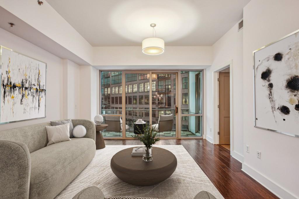 Westside Best-Side! In the HEART of the Westside, you'll find this Spacious, Light-filled Condo in White Provision. A friendly Concierge will greet you before you head up to unit 408. Step inside to find an Open Floorplan with Hickory Hardwoods throughout. The Kitchen is top of the line with a Breakfast Bar Island, gas range, and Stainless Steel Appliances. The Dining Room opens to the Living Room with City Views right next to the new Interlock ATL. This layout is perfect for Hosting and Entertaining Friends and Family! The Primary Bedroom features Floor-to-Ceiling Windows, a Spa-like Dual Vanity Bathroom with Marble Flooring, Soaking Tub, Frameless Standing Shower, and Walk-in Closet. A Spacious Bonus Room is perfect as an Office, Additional Living Space, or Guest Bedroom! This unit comes with TWO Secured Covered Parking Spaces only steps from the Condo. White Provision Amenities include a Concierge, Lap Pool, Fitness Center, Grilling Area, and even a Guest Suite! The amount of Atlanta's favorite Shopping, Dining, and Entertainment options just outside your doorstep is too much to mention, but include TWO One-Star Michelin Restaurants (Muj? and Hayakawa), Marcel, West Egg Caf , Puttshack, Cooks & Soldiers, and so much more! Easy Access to 75/85 for any commuting needs. You'll love living in Atlanta's Hottest Neighborhood!