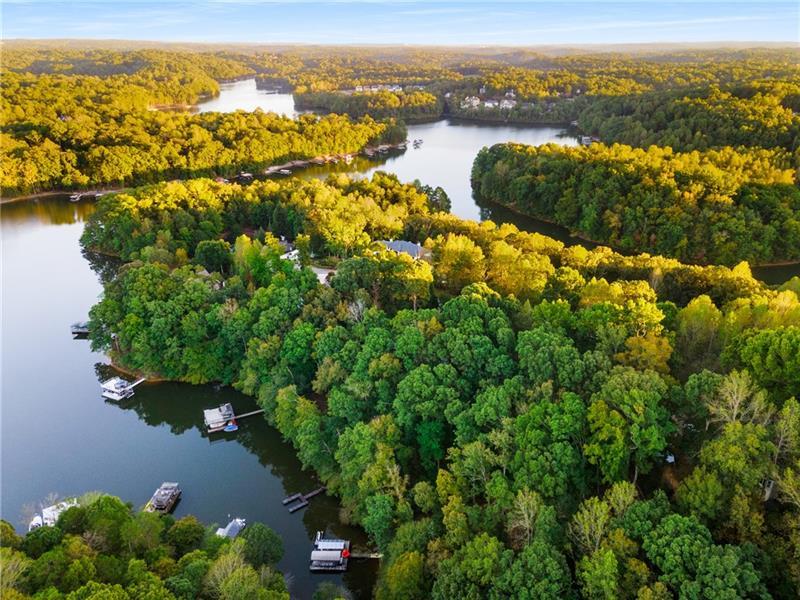 "For less than the cost of leasing a marina slip, you can own your own lakefront lot, complete with a private dock-and start living the lake life today". "Lake life made simple—seller financing as low as 2.95%. No banks, no hassle." Discover an exceptional lakeside opportunity on the serene shores of Lake Lanier. Spanning approximately .76 acres, this private lot in Fredericks Cove, Dawson County, offers stunning water and ridge views, perfectly framed by a peaceful cul-de-sac setting. With 106 feet of water frontage and the Corps of Engineers' line at the shoreline, this lot comes with an existing single-slip floating dock and an approved permit for an upgrade to a 24'x24' party dock. The property is primed for a four-bedroom home (soil testing complete), allowing for a terrace level that overlooks the lake and a level driveway for easy access. Imagine a custom lakeside retreat where you can enjoy sweeping lake views year-round, just minutes from the vibrant GA-400 corridor with the North Georgia Premium Outlets, dining, and shopping. For recreation and leisure, the property is within easy reach of the Chestatee Golf Club's championship course, Dahlonega's renowned wineries, Amicalola Falls State Park, and the scenic North Georgia mountains. With direct access to GA-400, Atlanta's attractions, and Hartsfield-Jackson Airport are all within easy reach, making this lot not just a retreat but a convenient base for exploring all North Georgia has to offer. Come and experience the beauty, tranquility, and endless possibilities of lakeside living at Lake Lanier.