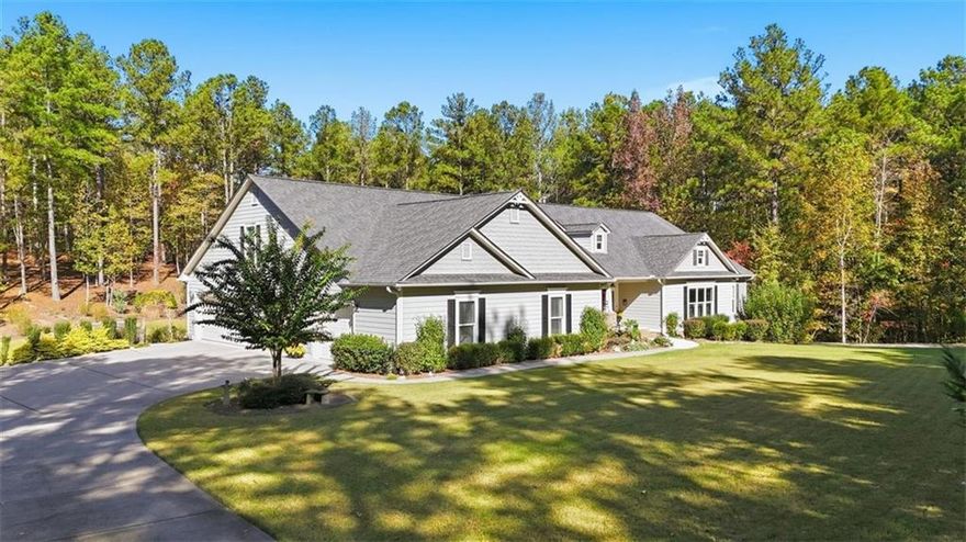 Instant Equity Opportunity – Priced Over $185,000 Below Recent Appraisal!
Experience the perfect blend of tranquility, luxury, and convenience in this stunning custom estate on over 5.3 private acres—just one hour from Atlanta and only 15 minutes from Lake Allatoona.

This thoughtfully designed 4-bedroom, 3.5-bath ranch with an upstairs addition offers spacious, comfortable living and exceptional attention to detail throughout. The open-concept floor plan is ideal for both everyday living and effortless entertaining.

The main level features two large bedrooms, including a serene primary suite with a spa-inspired bath featuring a double vanity, oversized jacuzzi tub, walk-in shower, and generous walk-in closet. A flexible secondary family room can easily convert back into an additional bedroom if desired.

The inviting dining area—large enough to seat up to 15—connects seamlessly to the living spaces with dual see-through brick fireplaces adding warmth and charm. The gourmet farmhouse kitchen includes granite countertops, a center island, stylish backsplash, modern appliances, and an expansive 9x11 butler’s pantry with abundant storage.

Natural light fills the living room, framed by triple windows overlooking the beautifully landscaped backyard and wooded surroundings. Upstairs, you’ll find two additional bedrooms, a full bath, and a large family or playroom with walk-in access to three oversized attic areas for exceptional storage.

Step outside to your own private oasis—an impressive 19x32 covered porch overlooking a professionally landscaped yard with a tiered saltwater pool and waterfall. Enjoy peaceful views and regular visits from local wildlife, including deer and turkey.

Additional Features Include:

Oversized 4-car garage (one bay currently a woodworking shop) with 50-amp service for EV charging

Detached 20x40 barn matching the home’s exterior—perfect for RV or boat storage, or a workshop

Private walking and ATV trails throughout the property

Picturesque creek along the rear boundary

Energy-efficient construction with three HVAC units

Owned 1,000-gallon buried propane tank

Private well with purification system and septic

Full-height crawl space for easy access and storage

Easy HOA with low restrictions—bring your RV, boat, and outdoor toys

Located just 1.5 miles from the Cherokee County line

Outdoor enthusiasts will love the proximity to fishing and kayaking just ¼ mile away and a public boat ramp at Lake Allatoona only 15 minutes from the property.

Bonus Opportunity: Adjacent 5.3-acre lot (186 Macedonia Rd, $230,000) is also available—perc-tested and ready to build. Ideal for multi-generational living, a future custom home, or investment potential.

With a recent appraisal of $1,085,000, this exceptional property offers immediate equity and the ultimate blend of privacy, luxury, and outdoor living