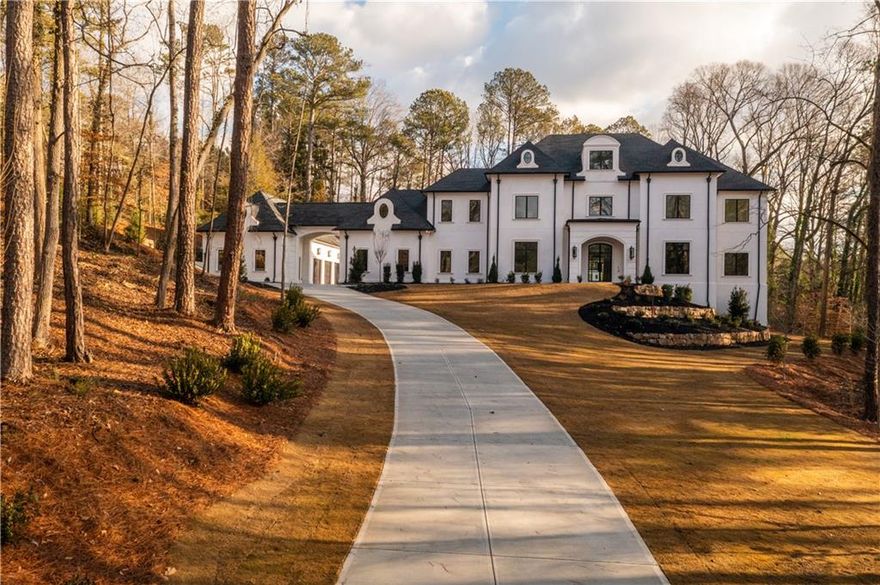 Extrodinary quality and craftsmanship by award winning builder, Loudermilk Custom Homes. Custom European Modern design situated on a wooded 2+ acre lot and featuring the finest designer selections, "smart" home technology and located in highly sought-after Chastain Park. Soaring three-story staircase and 12-foot ceilings on the main floor elevate the overall ambiance of this home. Additional features include 20-foot glass pocket doors, interior linear fireplace, 5-car garage, covered patio, and prep kitchen featuring a wine cooler, ice maker, and additional storage. Primary bedroom on main with private access to the laundry and two spacious closets and additional storage. Primary bedroom on main with private access to the laundry and two spacious closets. Secondary bedrooms upstairs with en-suite bathrooms and large flex room for future home amenities. The unfinished basement can accommodate an additional guest suite, home gym/sauna, office, media room and a future elevator to access all levels. This corner lot is the perfect location for entertaining with a walk out, first floor luxury pool and an outdoor cabana with a full bath. This luxury home is located within minutes of parks, schools, restaurants, and high-end shopping. 2024 completion and warranty is given. Roane Loudermilk, for any inquiries.
