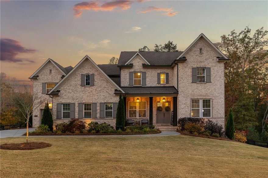 Located just minutes away from the bustling communities of Roswell, Crabapple/Milton, Alpharetta, and Woodstock this exceptional residence in Grand Reserve sets a new standard for luxury living. Meticulously designed with a focus on timeless elegance and contemporary comfort, every aspect of this home has been carefully considered to create a seamless living experience. Upon entry, one is greeted by a sophisticated ambiance and a well-designed layout that is perfect for entertaining. The main level boasts a formal dining room, a guest suite with a full bath, a spacious family room with a fireplace, and access to a screened-in back porch and open deck overlooking the beautiful backyard and resort-style pool. The gourmet kitchen is a chef's dream, featuring premium appliances, an oversized island with seating, and an abundance of natural light. Adjacent to the kitchen, a versatile flex room serves as an office or additional living space.

Boasting a two-car and one-car garage, this residence offers ample space for all your needs. An additional bonus room, complete with a full bath and closet, provides expanded options for entertaining or as an in-law suite setup. Upstairs, the primary suite exudes luxury with vaulted ceilings, a spa-inspired bath, and a custom walk-in closet. Three additional bedrooms, including one with an en-suite bath and two connected by a Jack-and-Jill, as well as a stylish laundry room, complete the upper level. The lower level of the home offers a custom-designed basement with a wet bar, bedroom, and bathroom. Step outside to the lower deck and experience the ultimate outdoor retreat, featuring a custom-built pool, spa, and outdoor kitchen. The property is surrounded by ample usable green space on all sides, tasteful landscaping, a full irrigation system, and low-voltage lighting providing a private garden ambiance. This meticulously crafted home offers a perfect blend of private sanctuary and entertainment spaces, making it an ideal residence for those seeking a refined lifestyle in one of Roswell's most prestigious neighborhoods. Welcome to a truly exceptional living experience.