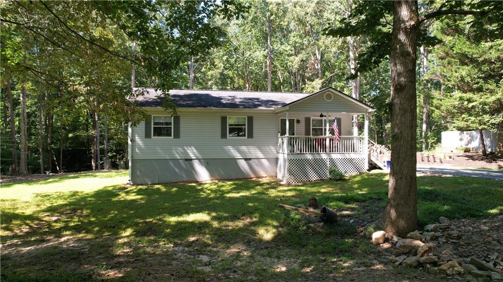 For Rent: Charming 3BR/2BA Ranch in Dahlonega
Welcome to your new home! This move-in-ready 3-bedroom, 2-bathroom ranch is perfectly located just 5 miles north of Dawsonville Outlet Mall and minutes from GA-400, shopping, and dining.
Set on a peaceful one-acre lot surrounded by mature hardwoods, the home features a spacious front yard, a classic rocking chair front porch, and a large back deck overlooking the serene backyard. Just perfect for relaxing or entertaining.
Inside, you’ll find fresh new LVP flooring throughout, plus a bright kitchen with elegant quartz countertops. The single-level layout makes for easy living, while the quiet location provides the comfort of country living with quick access to everything you need.