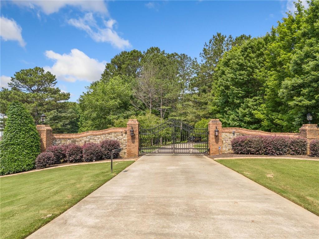 Nestled at on of Milton's premier addresses, this 3.43 acre homesite offers the perfect blend of natural beauty, access to wildlife, and exclusivity. The Enclave—a private, gated community—ready for you to come build your dream home. Peaceful setting, prime location, and endless possibilities. Membership at White Columns Country Club is available separately. Prospective homeowners may reach out to White Columns Country Club to learn more about membership options and amenities, including golf, tennis, swimming, and social events.