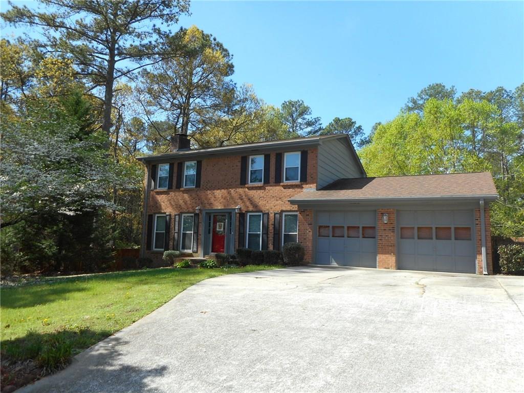 Beautiful updated and very cared for 4-sided brick home. Kitchen is renovated and modern with all stainless appliances. Hardwood floors throughout. Large deck overlooking the level lot with private fenced backyard. Close to great restaurants and shopping.