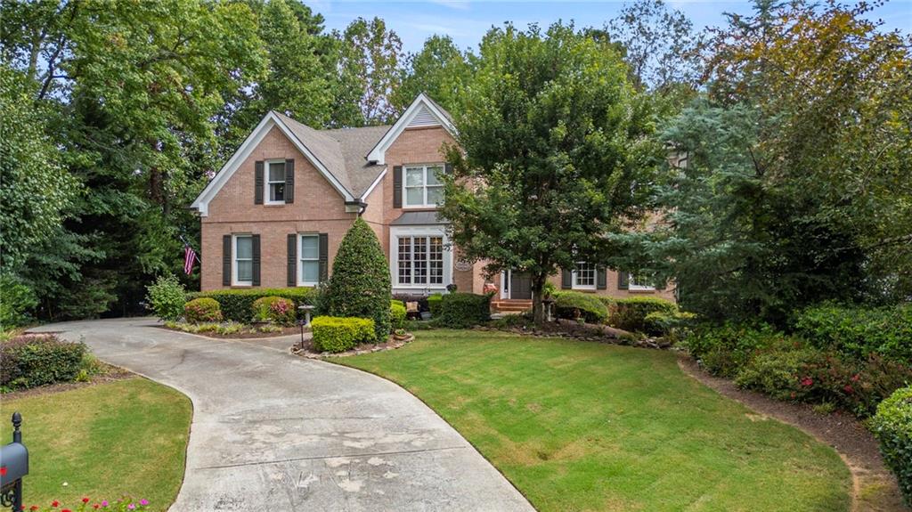 Nestled in Johns Creek—recently named the #1 Best Place to Live in the U.S. by U.S. News & World Report (2025–2026), this stunning traditional home offers the perfect combination of location, lifestyle, and luxury, with timeless curb appeal and thoughtfully designed spaces both inside and out. Offering a side-entry garage and a large, park-like backyard complete with a gazebo and firepit—ideal for outdoor entertaining. Inside, you’ll find a high-end custom kitchen featuring a gorgeous stained island, designer granite, beautiful tile and high-end stainless appliances including a microwave drawer, electric cooktop, double ovens and refridgerator, plus a stained built-in bar with wine cooler. The kitchen opens seamlessly to the fireside family room and a light-filled sunroom. The main level also offers flexibility with a private office that functions as a true bedroom, thanks to its closet and adjacent full bathroom. Oversized dining room effortly flows into formal living room. Enjoy your mornings with coffee on the large covered back porch or fire up the grill on the spacious deck.
The finished terrace level provides an entire additional living space, complete with a full kitchen, den, bedroom, bathroom, office, and a large recreation room that easily accommodates a pool table and more.
Situated in Fulton County’s #1 high school district, Northview, walking distance to the brand-new Cauley Creek Park and just minutes from the highly
anticipated Medley development.
The Huntington community is part of the highly desirable Shakerag neighborhood, residents enjoy exceptional amenities Olympic Size Pool, zero entry Kiddie Pool with water feature, 6 Tennis Courts, Full Basketball Court, Playground and Large Open Field.
More pictures coming soon!