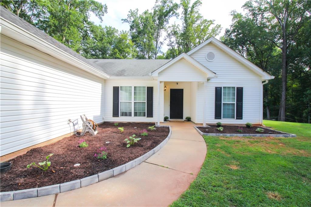 Welcome Home!!! Come and tour this Ranch style just off Hwy 316!
Featuring Updated Vinyl flooring, Open family room with fireplace, Updated bathrooms, Separate dining Area, Bay window breakfast area looking out into the private cleared backyard.
This house also features a Master bedroom with trey ceilings, and a master bath with tub and shower, walk-in closet.
Close to shopping centers and Athens! Excellent country Home!!!
Seller is motivated and ready to sell! Submit your offer!!!