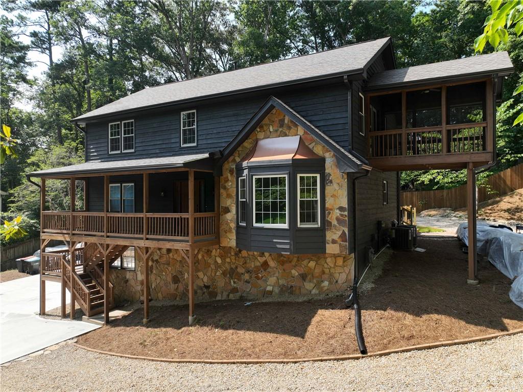Tucked away on a quiet, tree-lined cul de sac just eight minutes from the charm and culture of downtown Roswell, this one-of-a-kind retreat invites you to live boldly, breathe deeply, and roam freely. Set on a private ¾ acre wooded lot where deer wander through the trees and the hum of the city feels a world away, this four-bedroom, two and a half bathroom sanctuary was designed not just to shelter — but to inspire.
From the moment you turn onto the oversized driveway, there's a sense of welcome that’s rare and real. Whether you’re towing an RV, trailering your ATVs, or simply arriving home after a trip to the Roswell farmers market, there’s space — and soul — here for every rhythm of life.
The home itself is a study in rustic elegance: a fully renovated cabin-style haven where modern comfort meets organic warmth. Step inside and discover a kitchen that doesn’t just serve — it stuns. Veined Picasso marble stretches across the counters like art, anchored by brand-new stainless appliances and a large pantry designed for those who live — and cook — with passion.
Every room whispers intention, but the primary suite speaks in poetry. Vaulted ceilings with hand-hewn beams, a walk-in closet that feels like a boutique, and a private screened-in porch where morning coffee becomes a ritual of stillness and songbirds. The en suite bath is an echo of luxury, with a double vanity and curated finishes that strike just the right chord.
Outdoors, this property invites adventure. Morning hikes, muddy boots, dirt bike joyrides — or simply an afternoon curled up on one of the brand-new decks, watching the deer slip silently through the trees. This isn’t just a yard. It’s a private preserve.
Every inch of this home has been renovated to tailor to those who crave character. The neighborhood offers optional HOA membership. Residents can enjoy access to a community lake—perfect for kayaking, boating, or fishing from the neighborhood dock.