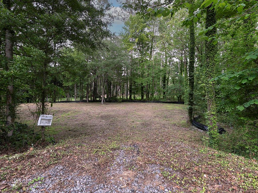 Rare opportunity to build your dream home on a spacious 1.10-acre lot in Marietta’s desirable East Cobb area. Perfectly positioned next to well-established homes, this parcel offers privacy, space, and the flexibility to design exactly the home and yard you want. Top-rated schools, convenient access to local shops and dining, and public utilities available at street — all while enjoying the charm of quiet neighborhood living. Don’t miss this chance to own land in one of Cobb County’s most sought-after locations.