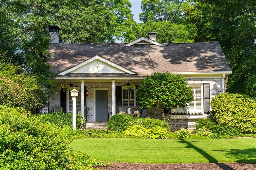 Step back in time with this charming 1920s home, perfectly situated just blocks from historic Marietta Square. Imagine starting your weekend with a stroll to the local farmers market, watching fireworks from your own front lawn on the 4th of July, immersing yourself in year-round festivals, and enjoying all the dining, shopping, and community events that make the Square so beloved.  Inside, this four bedroom, two bath home radiates warmth and character with original hardwood floors, millwork, and a gas log fireplace. The kitchen is a true heart of the home — a space that invites you to simmer a pot of soup or savor your afternoon tea. Outfitted with classic white cabinetry, new walnut butcher block counters, quartz-topped custom island, and abundant natural light, it’s a kitchen where memories are meant to be made.  The primary suite occupies the second level and offers a private retreat with a full bath, while the finished lower basement level provides flexible space for a home gym, media room, or casual hangout — plus ample storage. Outdoors, the charm continues with a beautifully landscaped yard, a welcoming front porch perfect for morning coffee, and a detached two-car garage.  This is more than a home. It’s a lifestyle steeped in history, community, and everyday comfort, all within steps of the vibrant Marietta Square.  Additional upgrades and features include:  Updated light fixtures, new interior paint, new HVAC system with EcoBee thermostats, tankless water heater, new garage doors and wall panels, and full irrigation system with new front sod.