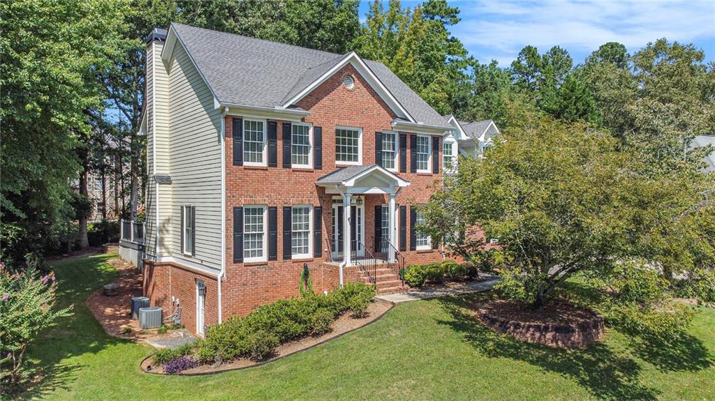 Welcome to 2045 Crossover Drive, a charming 4-bedroom, 2.5-bath brick home in the heart of Cumming. This beautifully maintained residence features fresh interior paint and new carpet, offering a move-in-ready experience. The finished basement provides additional living space, perfect for a media room, home office, or playroom. Step outside to discover a backyard oasis with extensive hardscape and lush landscaping that creates a true park-like setting—ideal for entertaining or quiet relaxation. Combining comfort, function, and natural beauty, this home is ready to welcome its next owners.