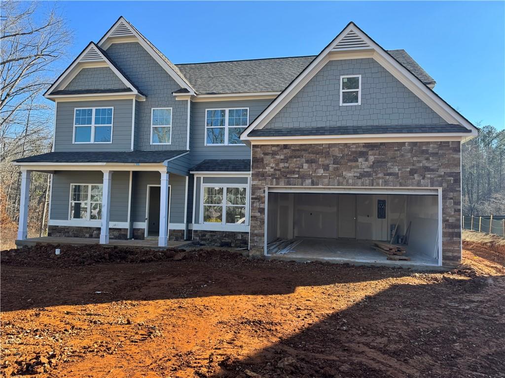 Woodbridge Plan at The Reserve at Willow Oaks BRAND NEW under construction now! Home will be ready to close in March! By far, a BEAUTIFUL, spacious home plan with bedroom on main and full bath! Kitchen features lots of cabinets-large island with GRANITE, SS appliances-all open to large 2 story family room w/fireplace & lots of windows-open rail-LVP floors! Separate dining area and separate office space on main! Oversized Owner's suite upstairs fits king with sitting area and large walk in closet! Owner's bath features separate tiled shower and soaking tub, raised height, dual vanities! Walk over with view into family room area! This home offers opportunity to opt for additional, available options! Don't miss this opportunity to buy a 5 bedroom NEW at this price point! Nice, private home site-wooded! This particular home site is within "Willow Oaks" side of a 2-part community! We are located just 2 miles off I575, close to DT Canton, DT Woodstock and DT Ball Ground-the Outlets & more! Special Buyer Incentives going on now!