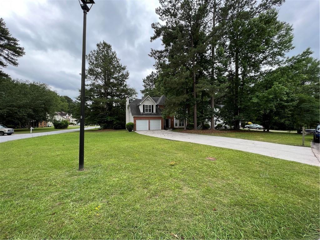 Wonderful and spacious home on a large corner lot! Check out this great property in the well established and quiet neighborhood of Lake Forest. This 4 bedroom and 2.5 bathroom has a lot to offer. Large primary suite with soaking tub, his and hers vanities, and walk in closet. Cozy fireplace in the family room. Deck in back off of the kitchen. All kitchen appliances included. Hurry! This home won't last long!