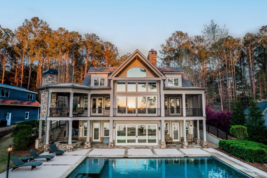 Beautiful Lakefront Home with Spectacular Sunsets, all while relaxing in your own private spa & pool!! Awesome custom-built home with extensive use of reclaimed beams and pine floors. Totally open, sleek and modern! No work needed here- everything is in turnkey condition. Big water views from all rooms. Wonderful location on Lake Oconee with Max dock and jet-ski lift. Spend all day swimming or skiing then relax by the pool or on the covered porch with fireplace for cool evenings. This home is newly furnished with high-end custom furnishings. This is just the right thing!! Possible 5th bedroom on lower level flex space.