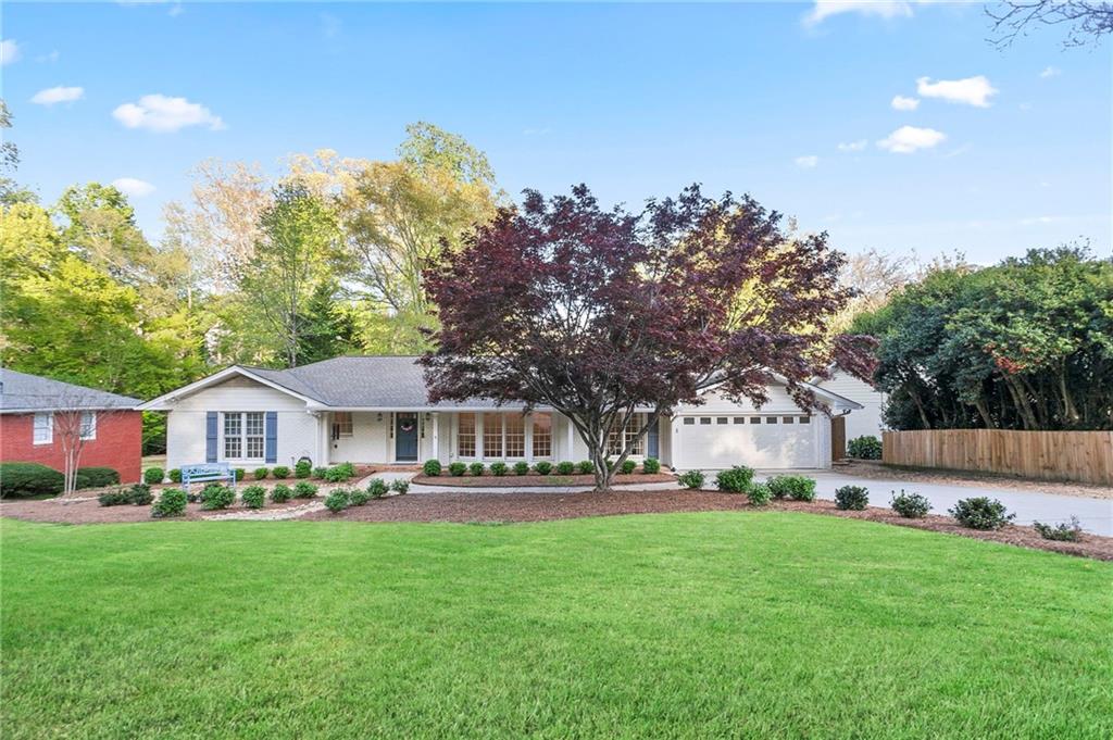 A rare Chastain Park home FOR LEASE! Available Now! The perfect transition home, whether you are new to the area and need a long-term home or a temporary residence* while your home is under construction or renovation. Located in the Heart of Chastain Park with Superior Schools, both Public and Private! This 4-bedroom, 3-bath home is ready for move-in. It features a freshly updated, bright, and white-painted brick exterior and interior. Formal Living and Dining Rooms and an Open Family Room to the Large Kitchen. 2 Refrigerators in both the Kitchen and adjoining the Kitchen is a Large Catering Space with a New Secondary. Refrigerator. This space also serves as a laundry room, complete with a new washer and dryer, and it also functions as a mud room. This space also accesses the 800+ square foot Updated Deck. This outdoor space has an Outdoor Kitchen with a 10-foot Concrete Countertop. The outdoor Kitchen includes a Blaze Grill with lighting, a Blaze Double Burner Cooktop, and a Refrigerator with Storage on the island. Also on the deck is a fireplace that creates a “three-season outdoor space” for you and your friends to enjoy. There is a place for a 55-inch TV if you wish. Also, off the deck is a Flat Backyard with a Fire Pit! Additionally, the interior of the home boasts three bedrooms on the main level and a second large family room with a wood-burning fireplace, an excellent space for a home office, ample storage, a cedar-lined closet, and a fourth bedroom with a third bathroom on the walk-out terrace level. Off the 4th Bedroom is a conditioned space that could be another seasonal closet or reimagined for your needs. Please note that all of the Baths have been updated! Of course, let's not forget about the area! Walk to the Chastain Park Amphitheater, the Chastain Park Golf Course, and the community Pool. Bring your Horse!... There is also the Chastain Horse Park, which is 1 of 2 remaining Urban Barn facilities in the United States. We could keep going, but you really need to see this home and the neighborhood to appreciate it. Landscaping for the beautifully manicured front lawn and backyard maintenance is included. (A minimum 6-month lease is available at $9500 per month. Terms and Conditions Apply)