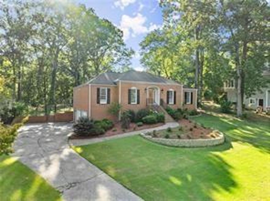 This is your new home! Located in the heart of east Cobb you will find this meticulously maintained brick ranch. Features include: 4/5 bedrooms, 3 full baths. Entry foyer, formal living room, great room with cathedral ceiling, brick fireplace & exposed beams, modern kitchen with breakfast area, ceramic tile, white cabinets, quartz counter tops, new stainless steel appliance package including gas range, dishwasher, and refrigerator. formal dining room, bright & open floor plan perfect for entertaining, huge sunroom with marble flooring and recessed lighting. On the lower level you will discover a stepless entry, marble floors, full bath, a complete second kitchen with new appliances including, electric range, microwave & dishwasher, center island breakfast bar, quartz counter tops, 4th bedroom with a media room or could be used for a 5th bedroom or even home office. Updates through out including HVAC system, private fenced back yard, gated access to the serene pond area located at the back of the property, 2 car side entry garage plus extra storage area. Do not miss this one.