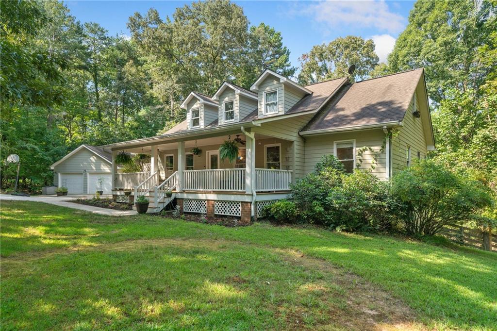 WELCOME TO THIS BEAUTIFUL TRADITIONAL HOME FOR SALE IN DAHLONEGA! Perfectly situated just MINUTES FROM DOWNTOWN DAHLONEGA, this SPACIOUS 6-BEDROOM, 4.5-BATHROOM HOME offers the ideal blend of MOUNTAIN TOWN LIVING and modern comfort.
You'll love the FLEXIBLE FLOORPLAN featuring 3 BEDROOMS ON THE MAIN LEVEL, 2 LARGE BEDROOMS UPSTAIRS, a MASSIVE BONUS ROOM, and a PRIVATE BEDROOM IN THE FINISHED BASEMENT — ideal for guests, a home office, or a media space.
Enjoy HARDWOOD FLOORS THROUGHOUT, COZY CARPETED BEDROOMS, and a TILED TERRACE LEVEL. The OPEN-CONCEPT KITCHEN is outfitted with WOOD CABINETS, STONE COUNTERTOPS, and a BRIGHT BREAKFAST AREA — perfect for entertaining and everyday living.
Step outside to your FENCED-IN BACKYARD, WOOD DECK, and GROUND-LEVEL PATIO — an excellent setup for grilling, relaxing, or letting pets play. The home sits on a PRIVATE LOT, features a 2-CAR DETACHED GARAGE, and runs on a PRIVATE WELL, offering added independence and savings.
This is a rare opportunity to own a LARGE FAMILY HOME in one of North Georgia’s most desirable small towns. If you're looking for HOMES FOR SALE IN DAHLONEGA GA with space, privacy, and proximity to DOWNTOWN DAHLONEGA, this one is a MUST-SEE!