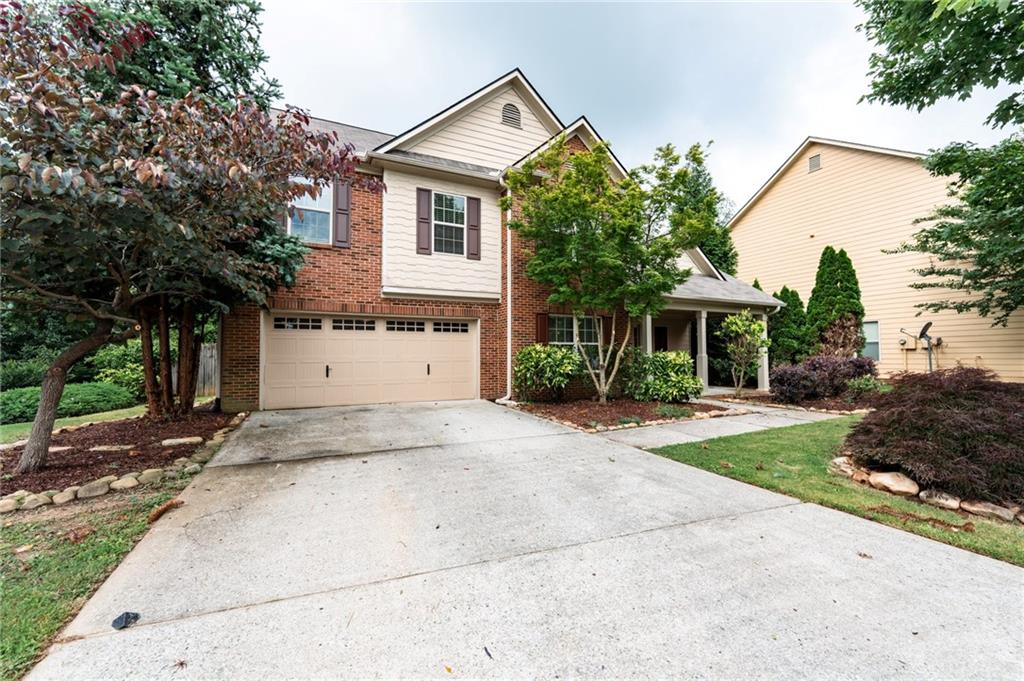 Welcome to this beautifully maintained brick-front home that blends space, comfort, and everyday style. From the inviting covered front porch to the light-filled interior, this home is designed to impress. The formal dining room features elegant coffered ceilings, while the open-concept family room with a cozy gas fireplace flows seamlessly into the kitchen—complete with granite countertops, tile backsplash, breakfast bar, and a spacious dining area overlooking the backyard. A main-level bedroom and full bath offer flexible space for guests or a home office. Upstairs, enjoy a large loft perfect for a second living room, playroom, or media space. The oversized primary suite feels like a true retreat with vaulted ceilings, a spa-style bath, and a walk-in closet. Three more bedrooms and a full bath round out the upper level. Outside, the fully fenced, level backyard offers privacy and plenty of space for relaxing or entertaining. Plus, a new roof installed in April 2025 means peace of mind from day one. This move-in-ready home offers the space you need with the updates you want—don’t miss it!