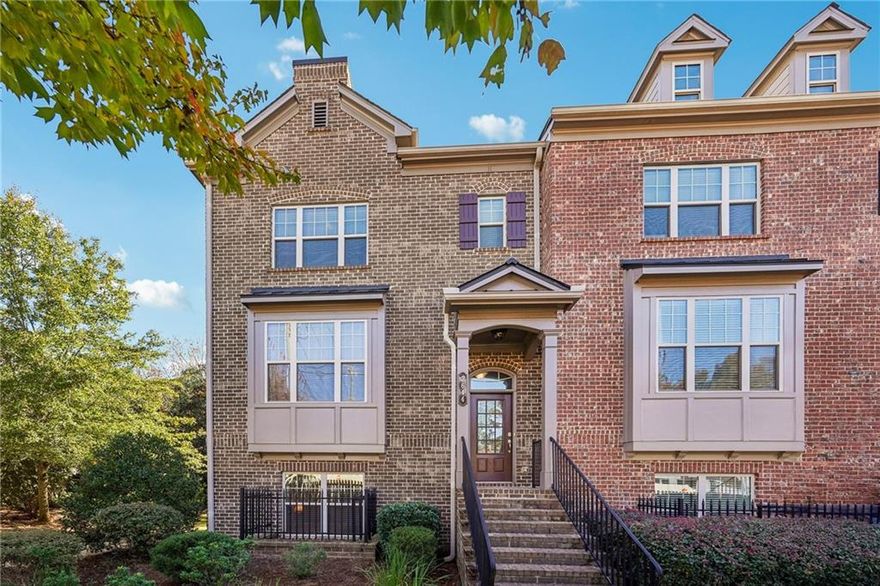 Welcome to this stunning end-unit town home in the sought-after Sonoma gated community, just minutes from Downtown Alpharetta, Avalon, top dining, shopping, and quick access to GA-400. One of only a select few homes in the community with its own additional parking pad, this 4-sided brick residence shines with both elegance and convenience. Step inside to discover a meticulously maintained 3 bedroom, 3.5 bath home filled with natural light and thoughtful upgrades. The gourmet kitchen is a chef’s delight, showcasing granite counter tops, stainless steel appliances, rare double ovens, a gas range, and a spacious walk-in pantry. Rich hardwoods flow through all three levels, with the exception of the bedrooms. The upper level features a secondary bedroom with vaulted ceilings, a full bath with a tiled tub/shower combo, and a convenient laundry room. The owner's suite provides a peaceful retreat with vaulted ceilings, abundant sunlight, and a luxurious en-suite featuring separate vanities, a deep soaking tub, a large walk-in shower, and a custom-designed walk-in closet. The finished terrace level offers fantastic flexibility with a 3rd bedroom, full bath, storage space, and access to the two-car garage. The garage features epoxy flooring. There is also a hardwired alarm system in the home. Enjoy quiet mornings or relaxing evenings on the private open-air deck. Community amenities include a cozy firepit gathering area and a dedicated dog park. A lifestyle of comfort, style, and convenience awaits in this exceptional end-unit home.